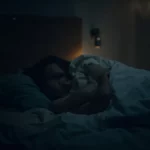 Person sleeping soundly in bed, representing restful sleep influenced by intermittent fasting