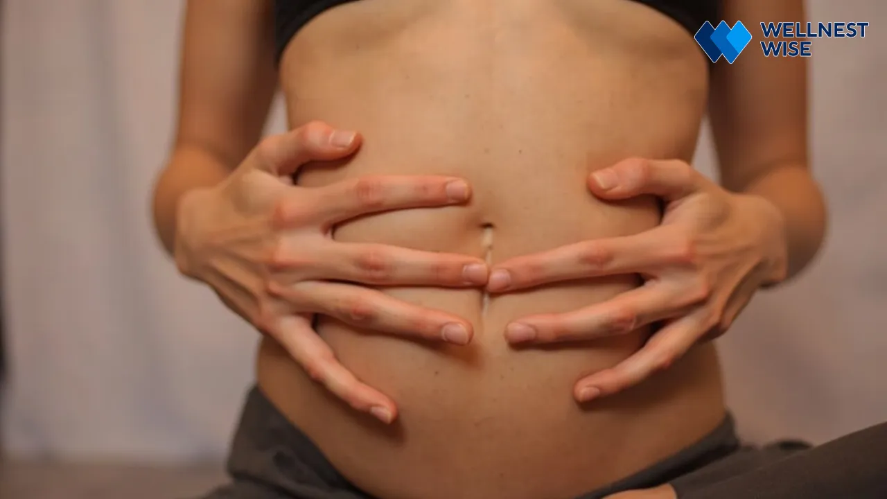 Close-up of hands on abdomen demonstrating diaphragmatic breathing for 5.5 second breath