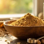 Wheat germ powder in a bowl with measuring spoon, nuts, and milk, symbolizing healthy weight gain ingredients.