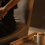 Person using gentle hand movements for abdominal massage to relieve gas and bloating immediately